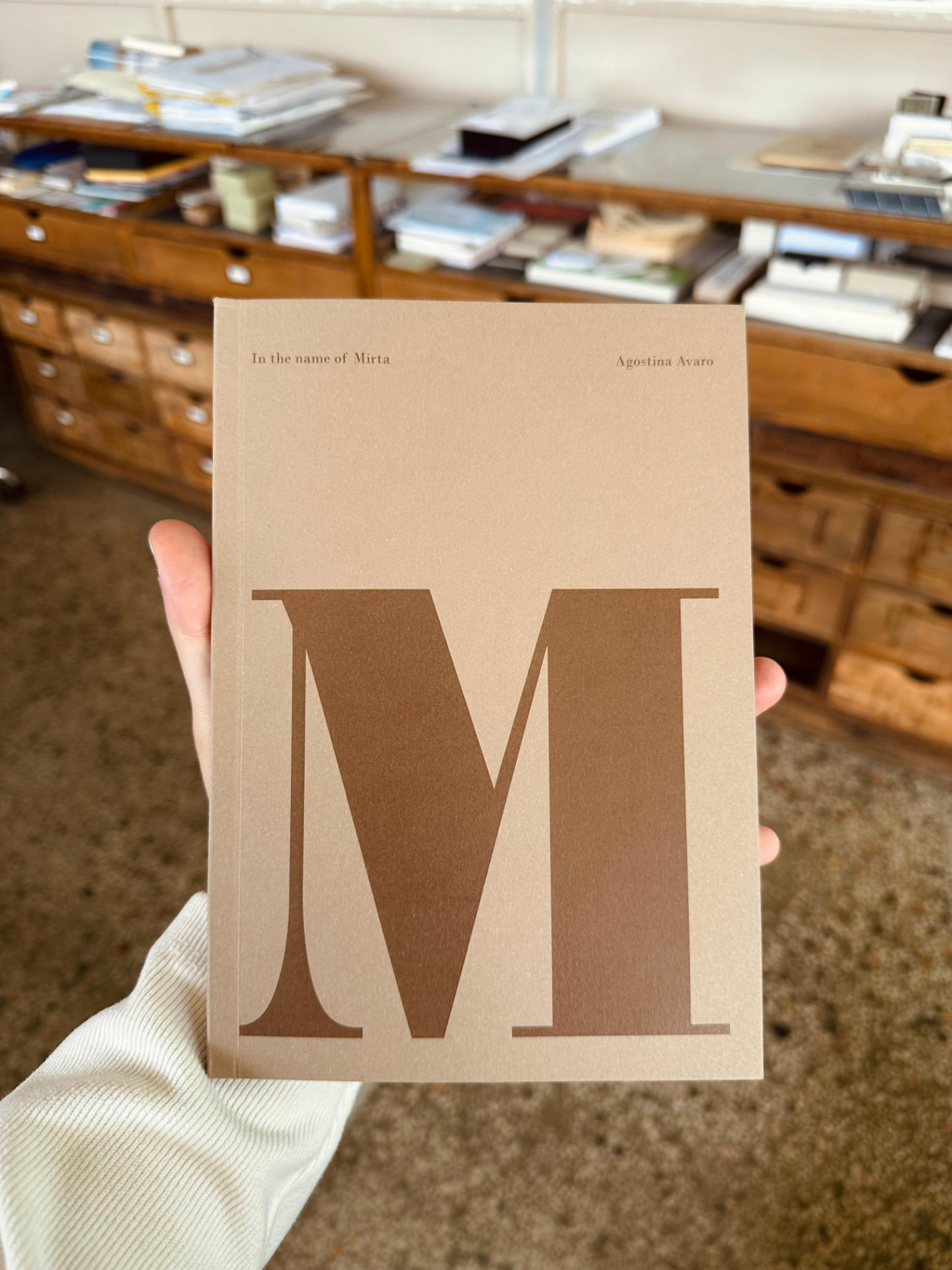 Agostina Avaro holding the cover of In the name of Mirta